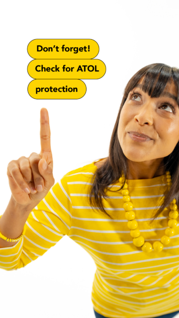 Woman pointing to a sign. Don't forget to Check for ATOL protection